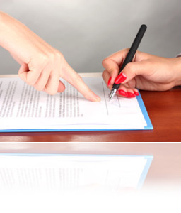 signing of treaty on wooden table on color background